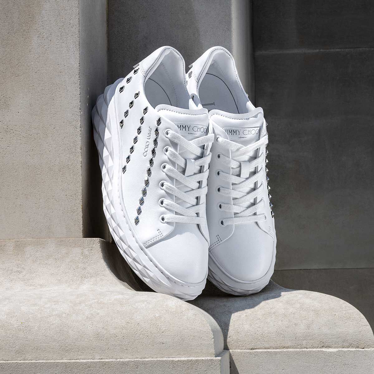 White trainers clearance with studs